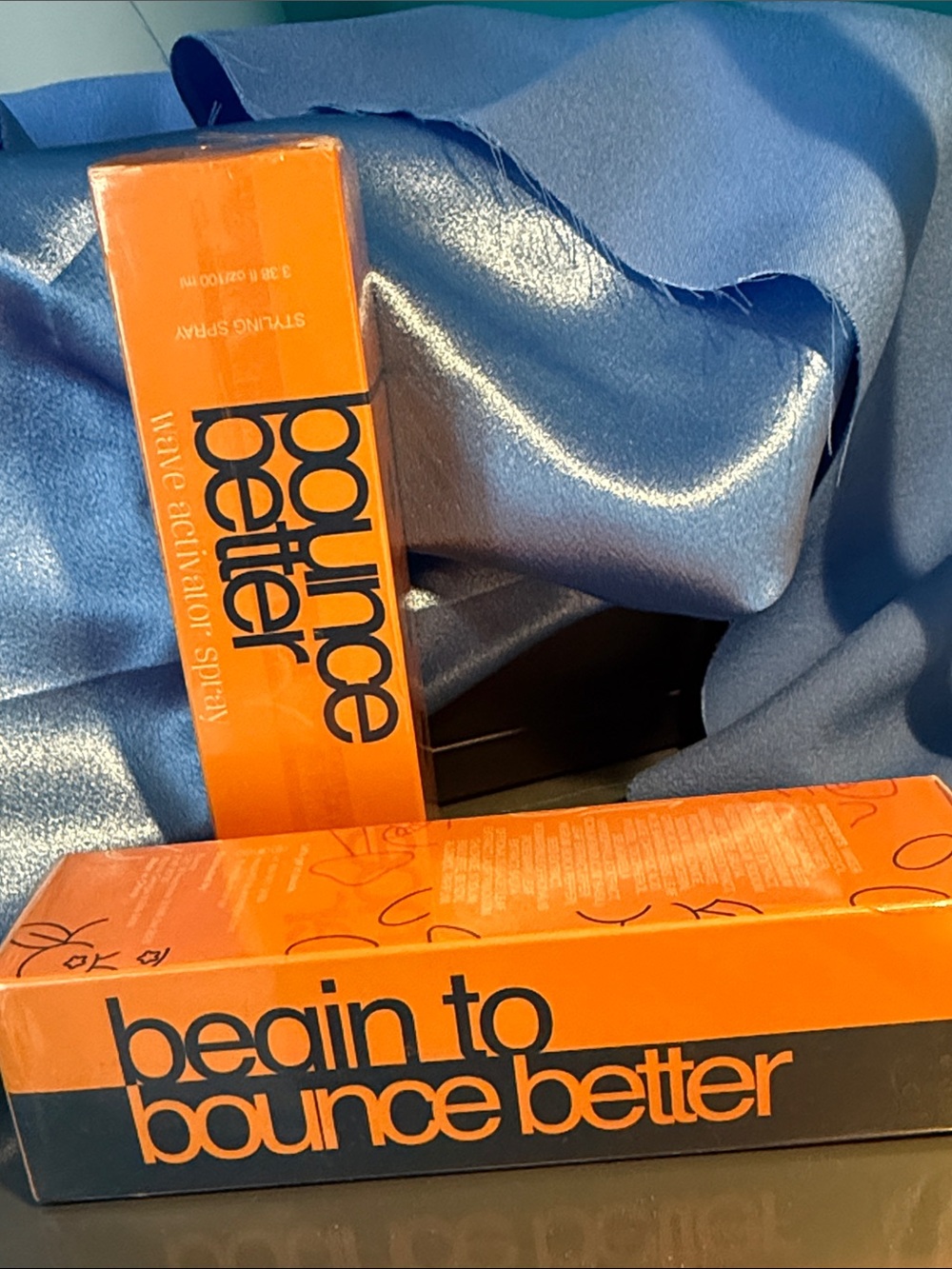 2pack. Bounce Better Styling Spray — Bright Orange Packaging. New in packaging